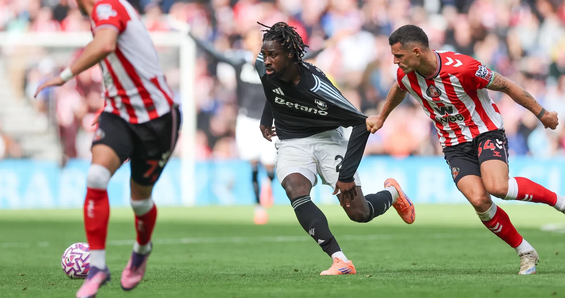 Aston Villa player sprinting during match against Sunderland
