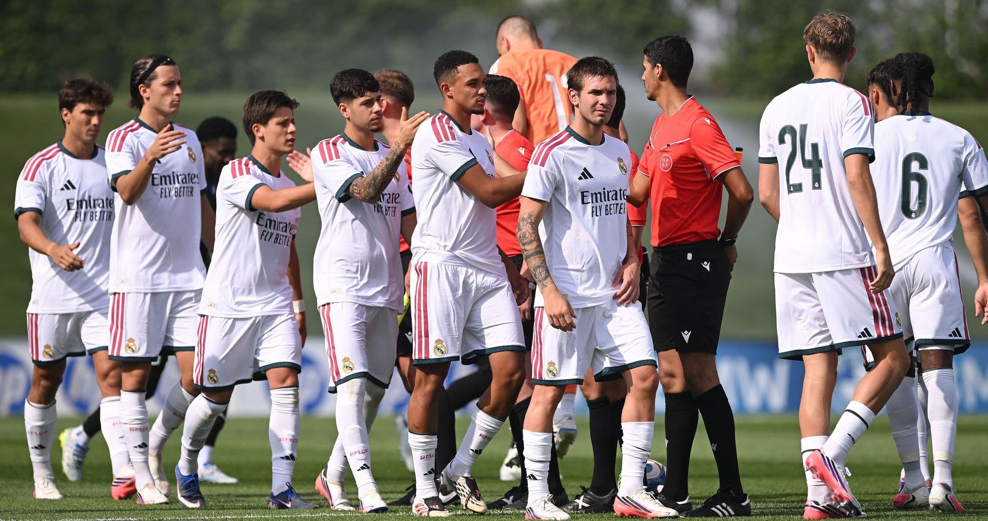 Real Madrid players greeting officials before training