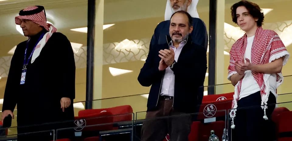 Spectators applauding in a stadium box area