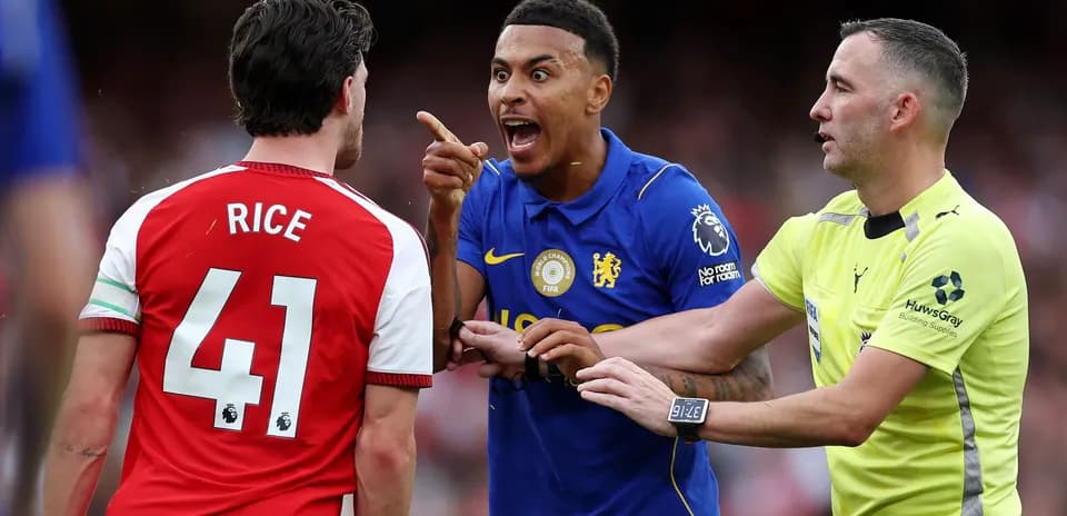 Players arguing with referee during a match