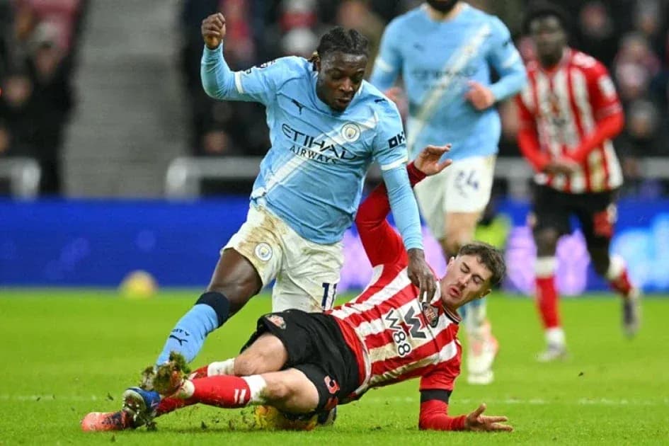 Player tackling opponent during football match