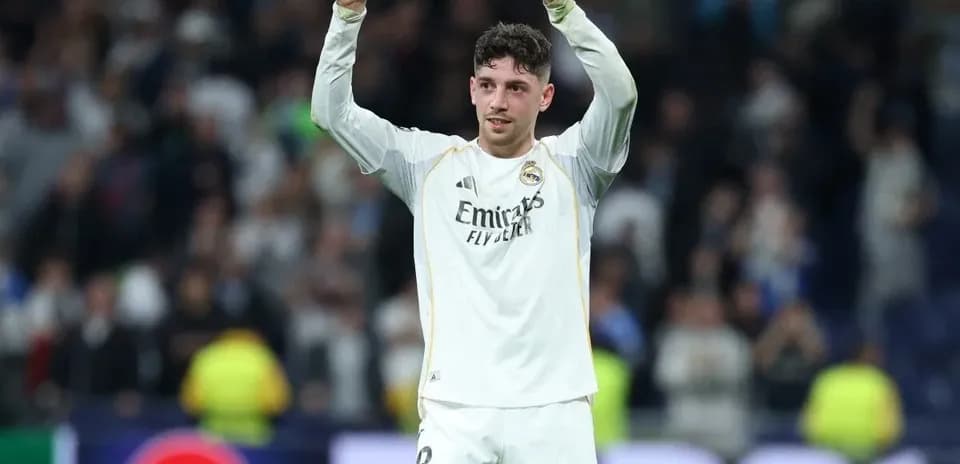 Player celebrating with arms raised after match
