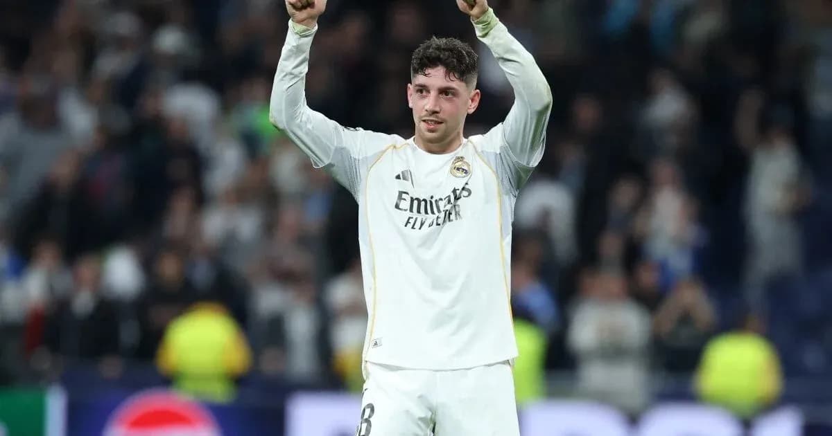 Player celebrating with arms raised after match