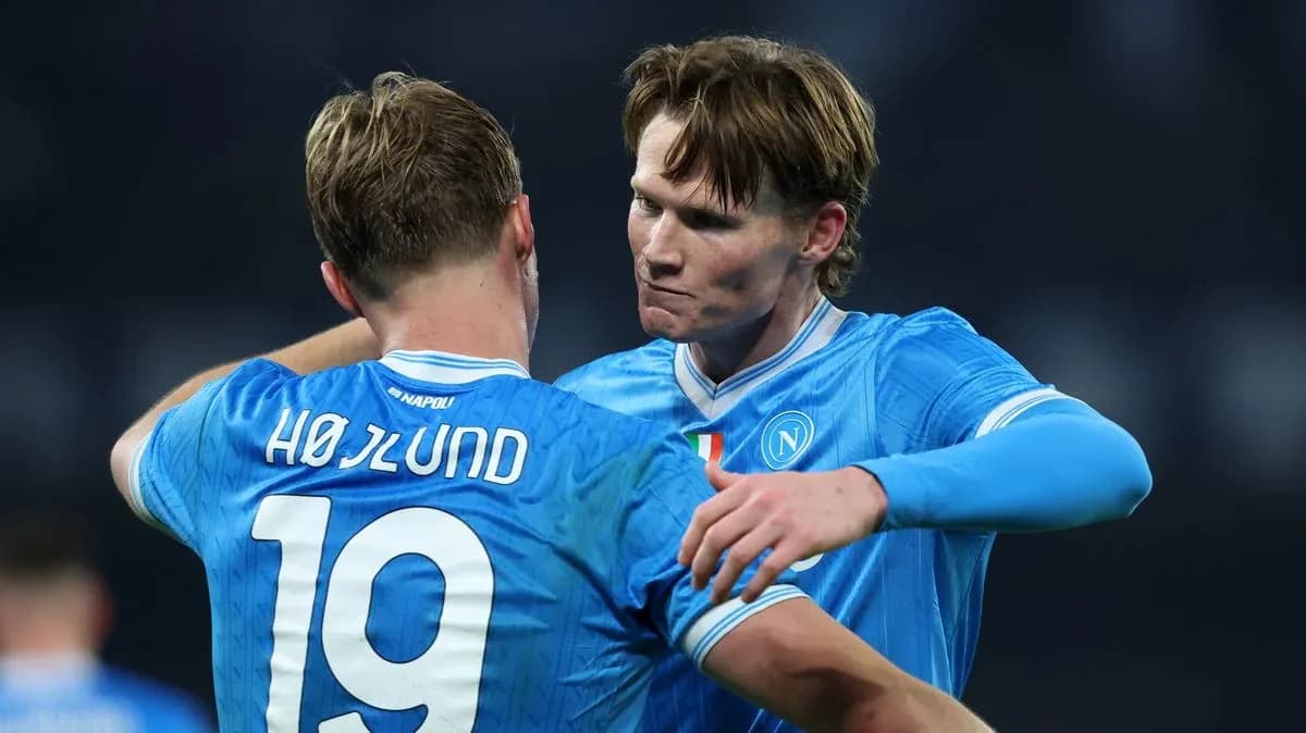 Two Napoli players embracing on the field