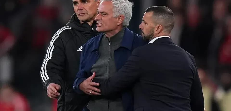 Manager being restrained during a heated moment