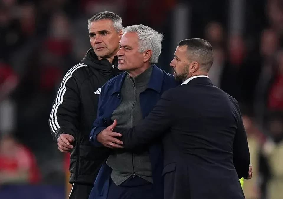 Manager being restrained during a heated moment