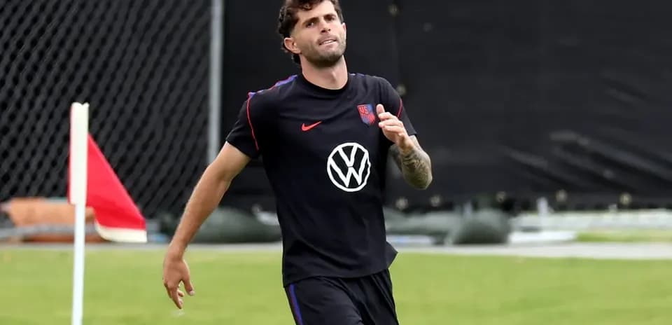 Player jogging on training pitch with corner flag