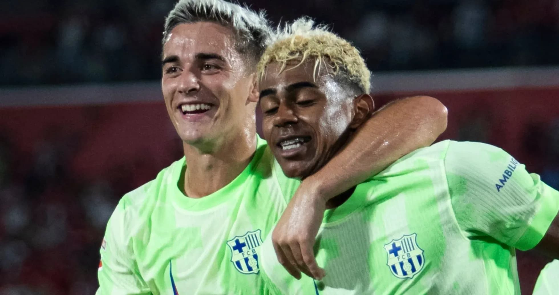 Two players celebrating together on the field