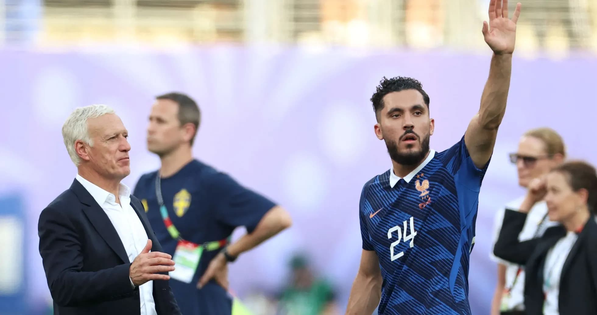 France coach with player waving on the pitch