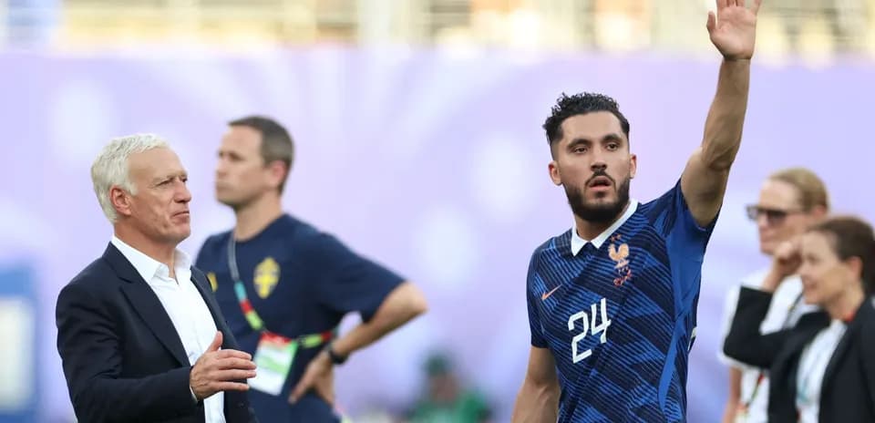 France coach with player waving on the pitch