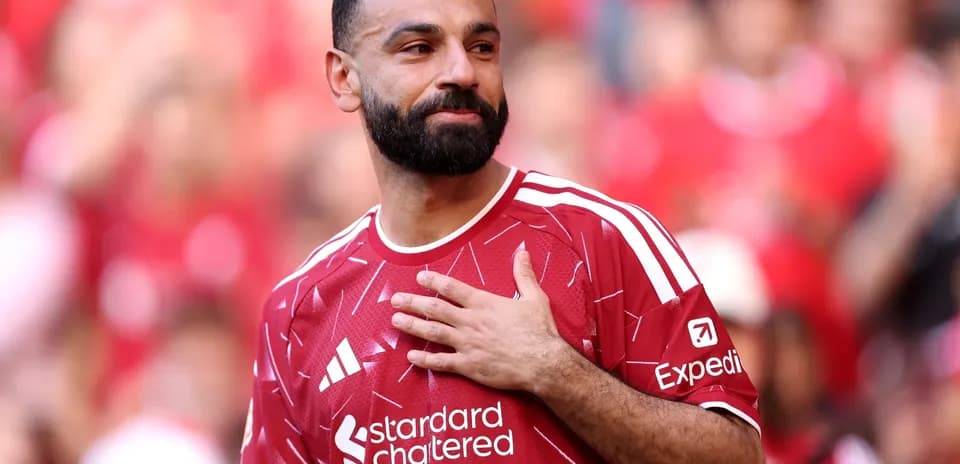 Player in red jersey gestures during presentation