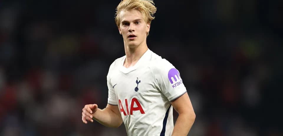 Player in Tottenham jersey during match action