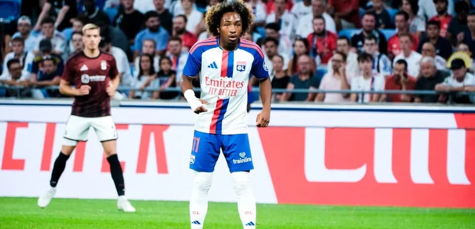 Player in Lyon kit during a match on field