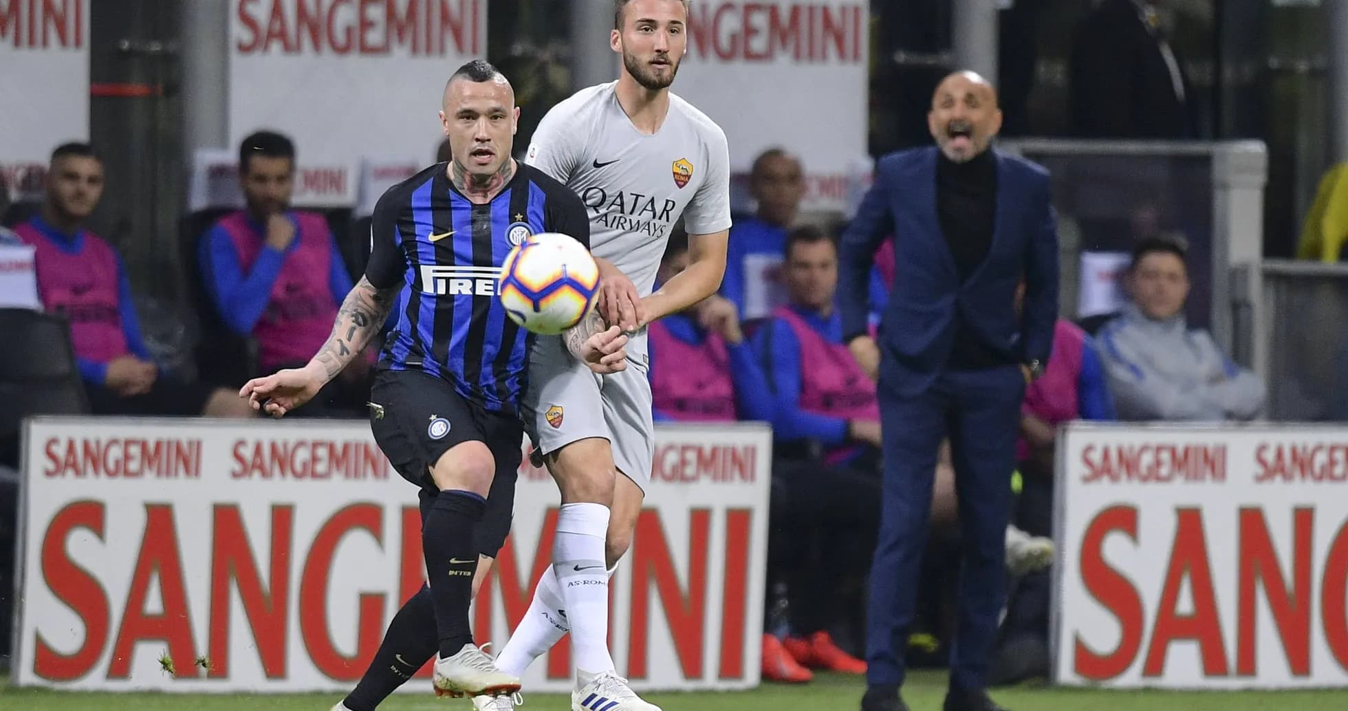 Inter and Roma players contesting for the ball