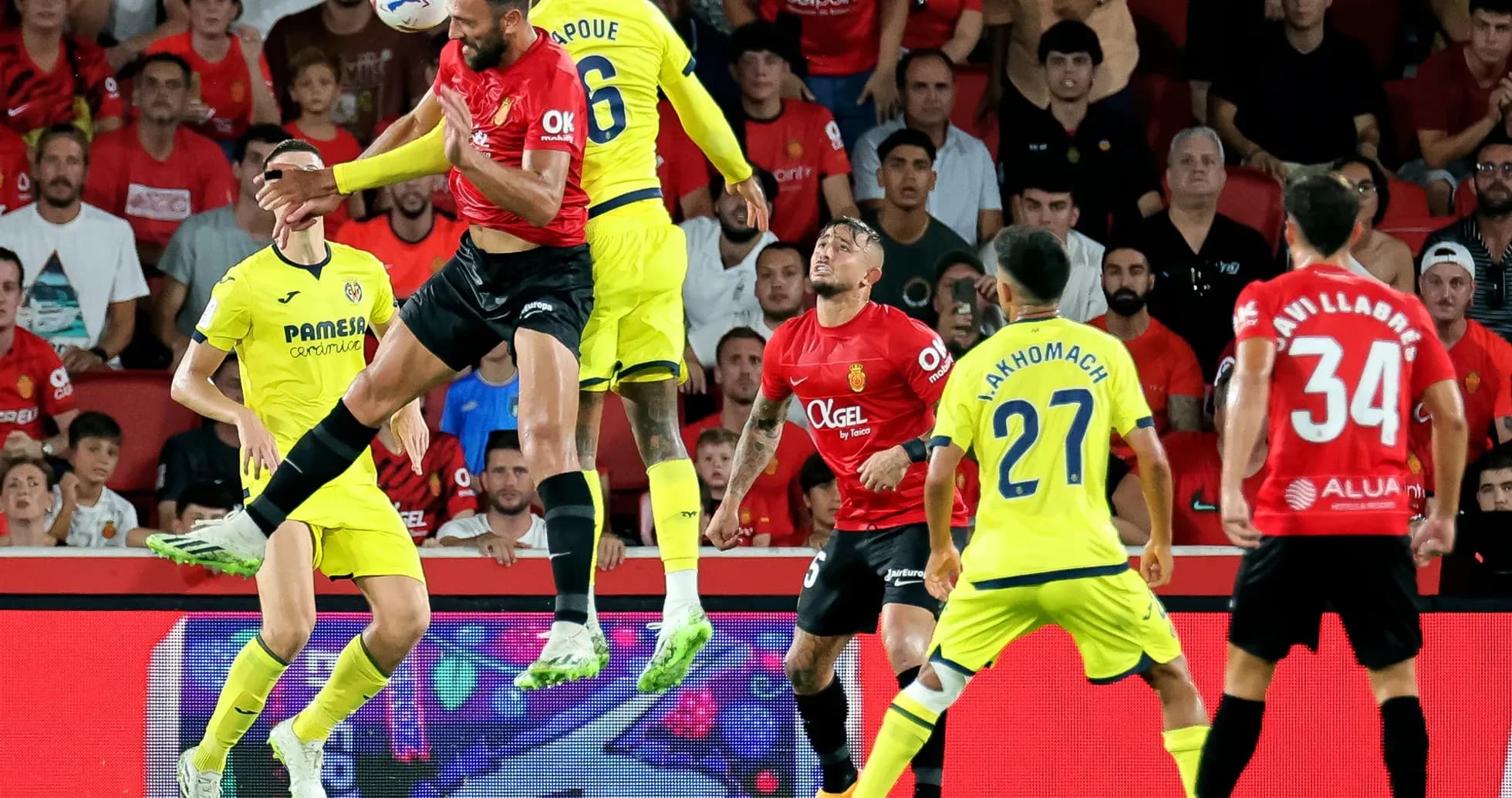 Players competing for the ball in La Liga match