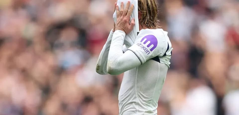 Player putting shirt over head during match
