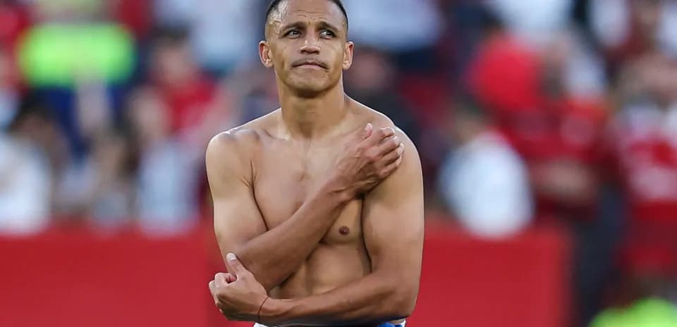 Player with no shirt looking around in stadium