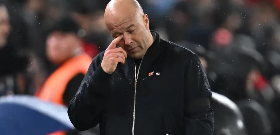 Coach wiping his brow during a match