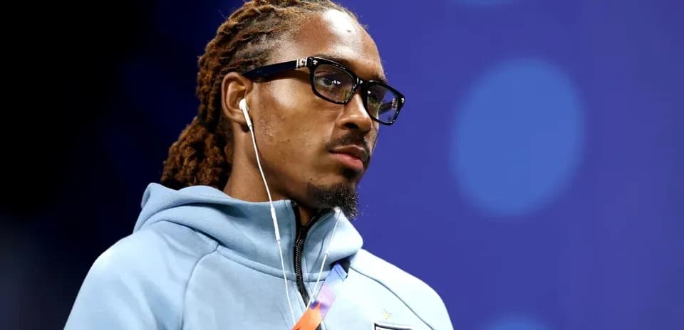Player wearing glasses and headphones before match