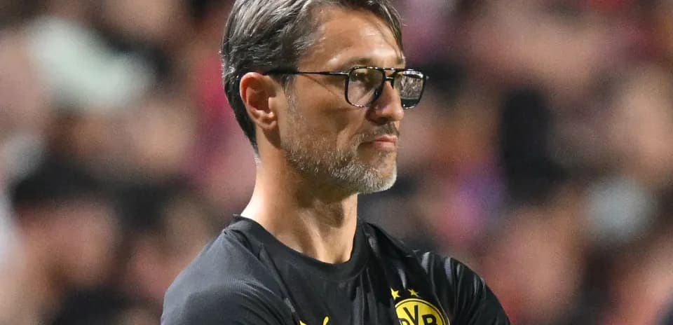 Coach observing match from the sidelines