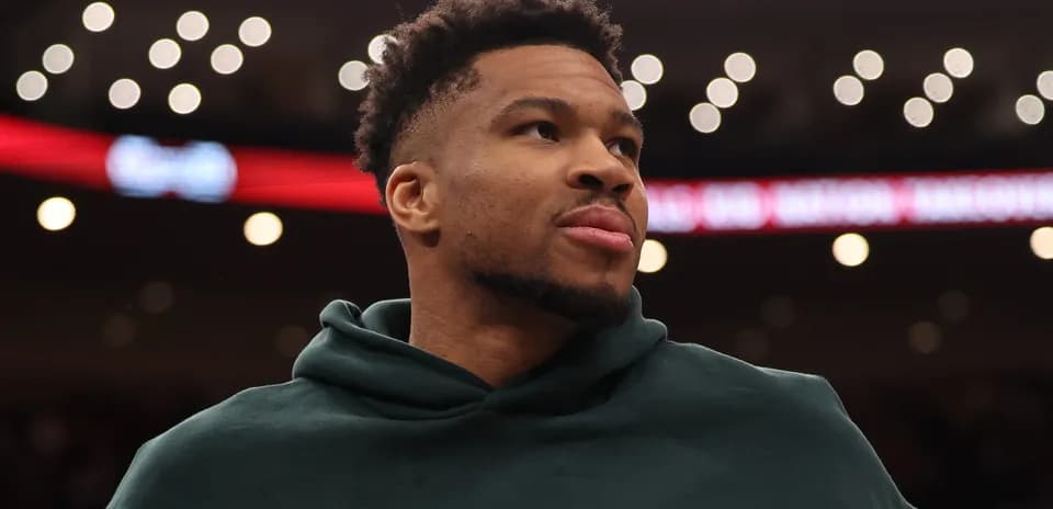 Player wearing hoodie during game warm-up