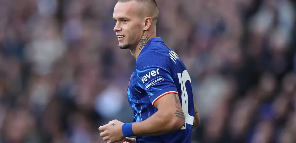 Player wearing blue jersey with number 10 on field