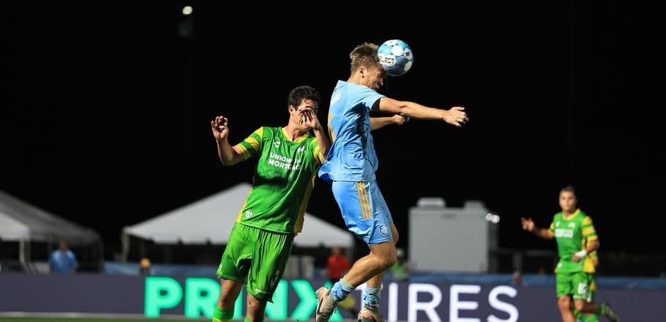 Players contesting for the ball during match