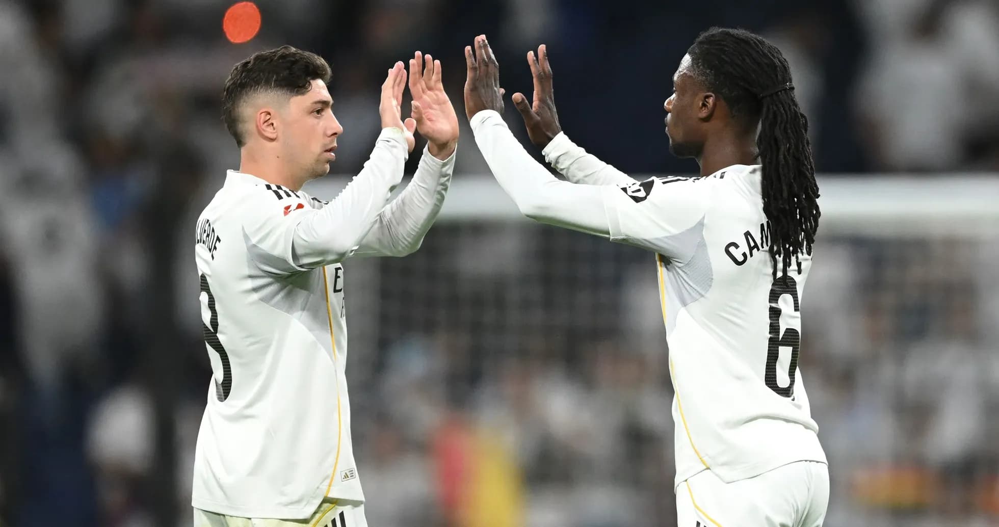 Two players high-fiving during a match celebration
