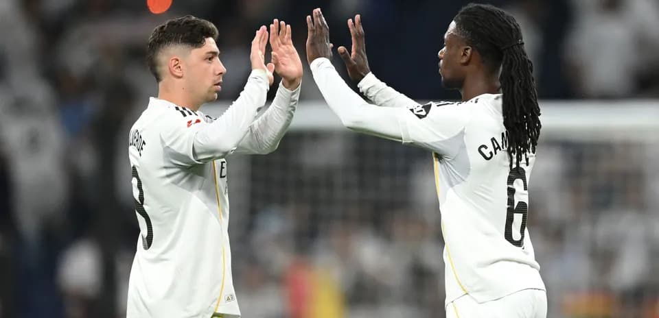 Two players high-fiving during a match celebration