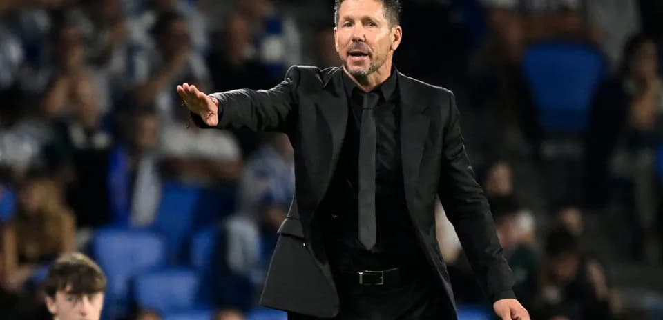 Coach directing players during a match