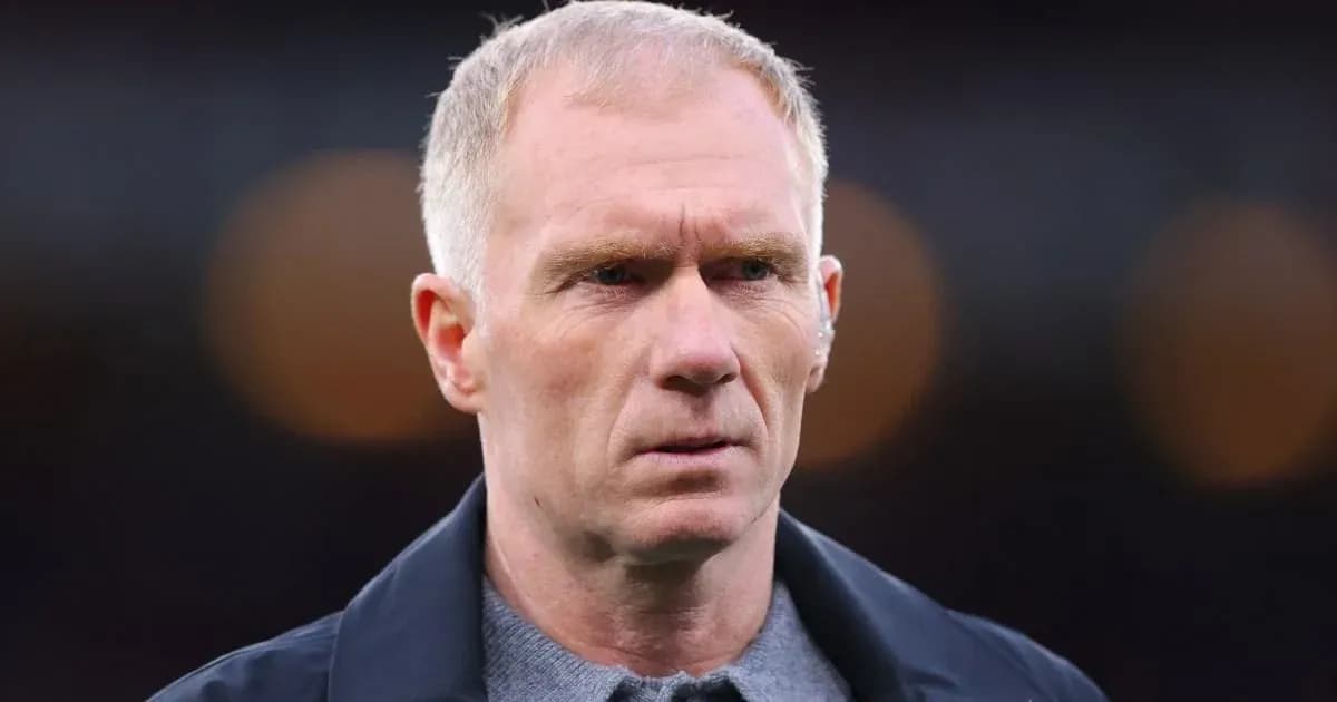Man with short hair looking intently at camera