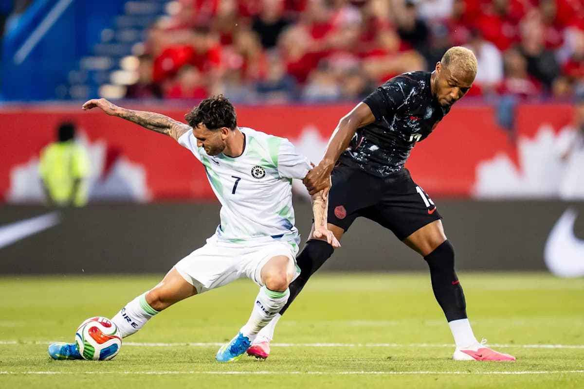 Two players competing for the ball on field
