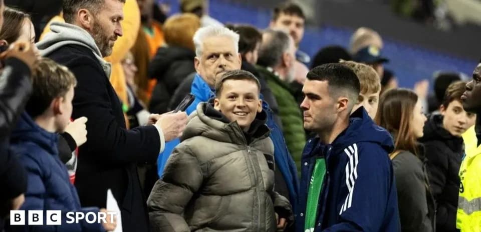 Fans interacting in the stands after the match