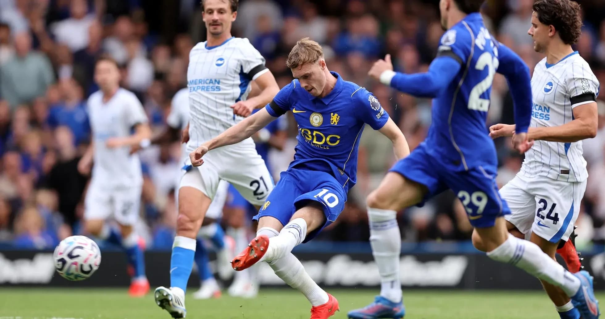 Chelsea player shooting at goal against Brighton