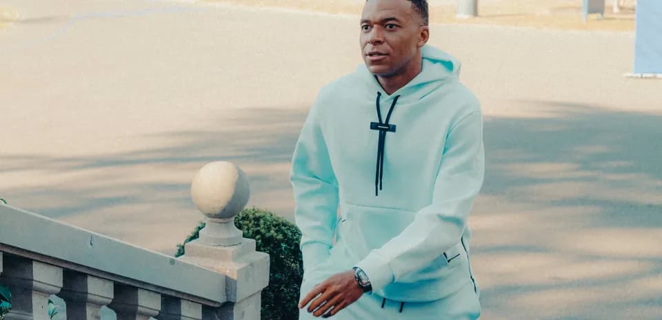 Player walking up steps in light blue outfit