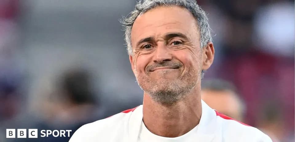 Coach smiling during a match at the stadium