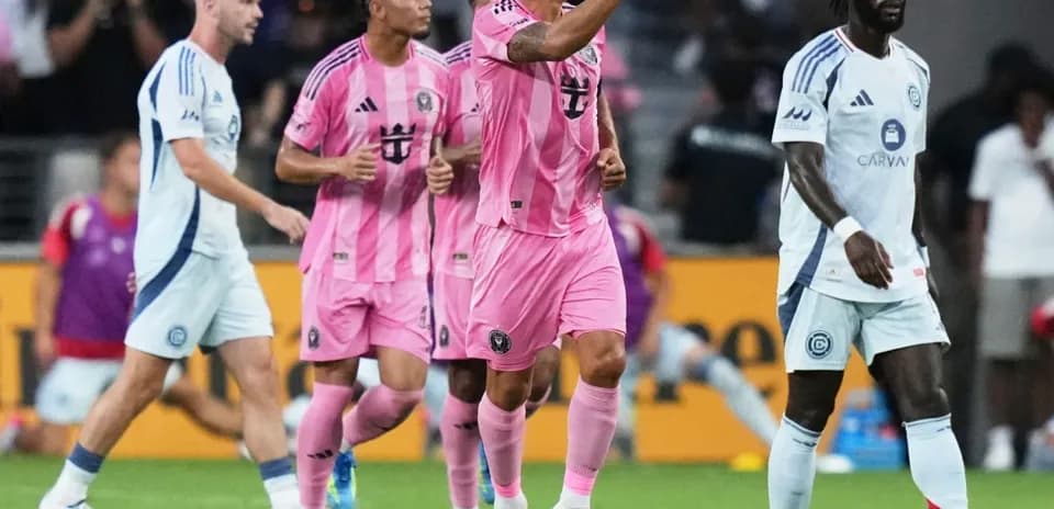 Players celebrating a goal during a soccer match