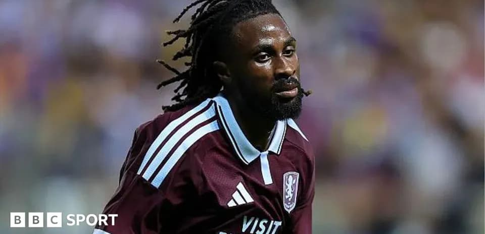 Player in maroon jersey running on the field