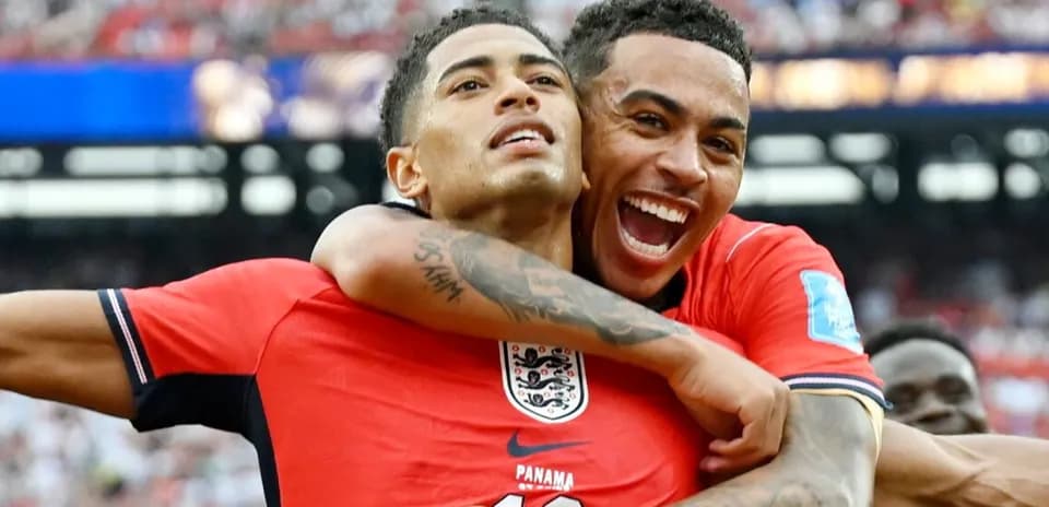 Two players celebrating a goal during a match