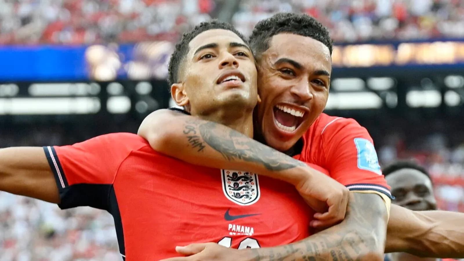Two players celebrating a goal during a match