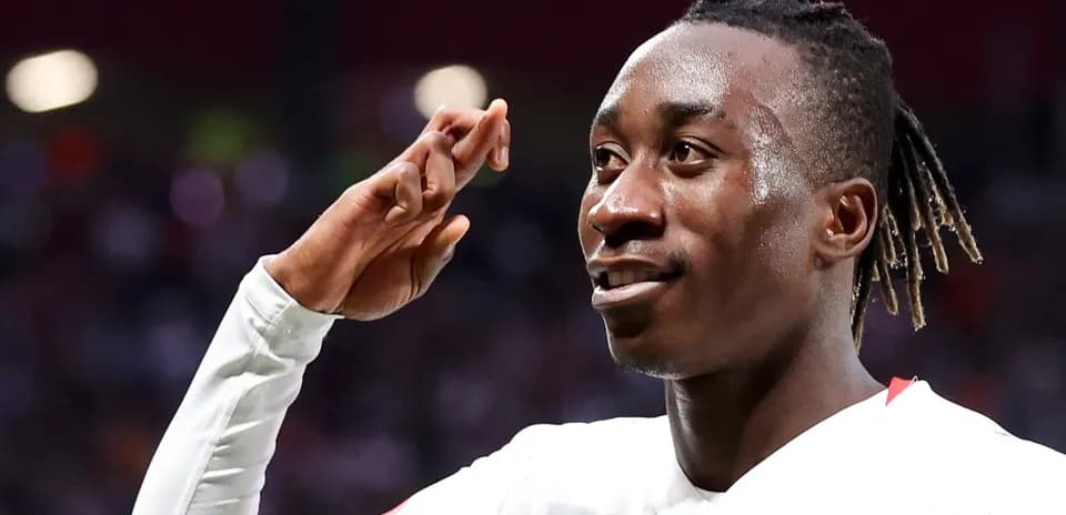 Player celebrating with a salute gesture after scoring