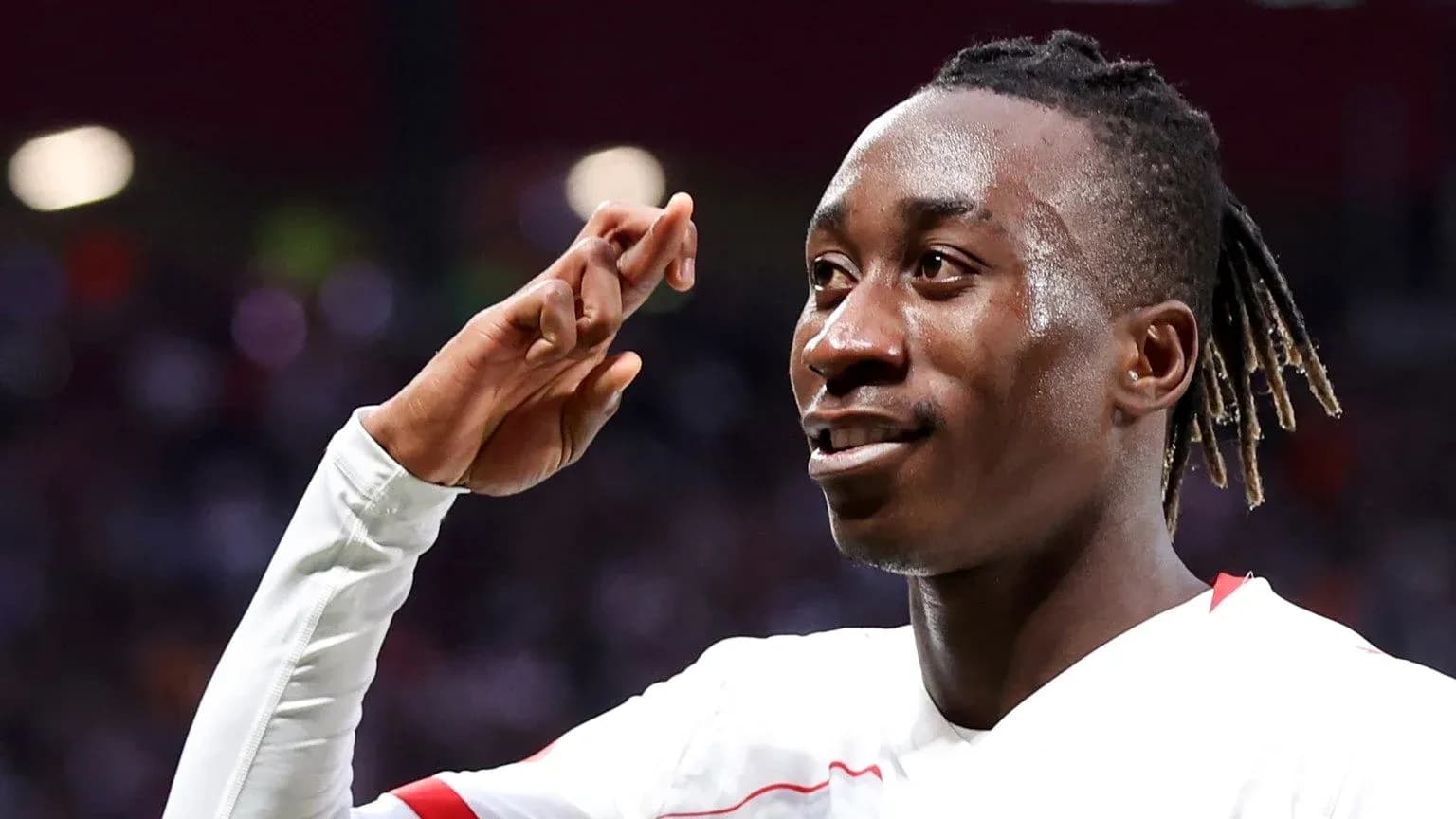 Player celebrating with a salute gesture after scoring