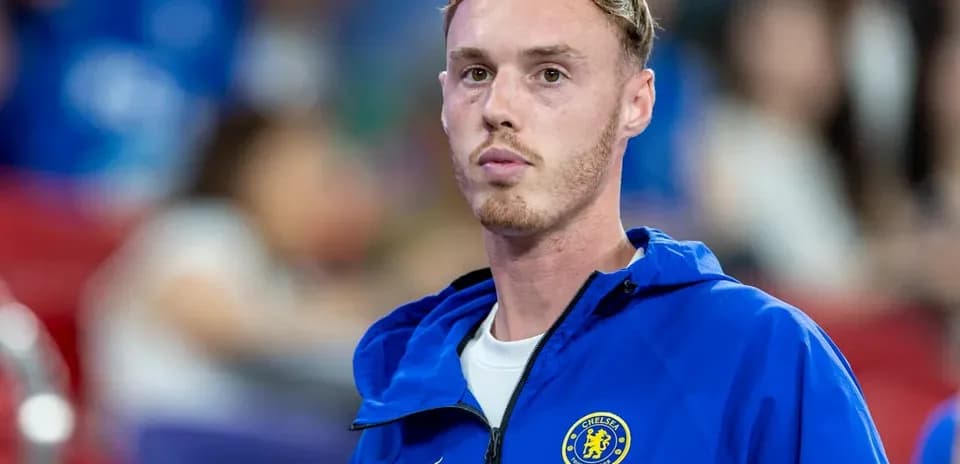 Player in Chelsea training jacket on the sidelines