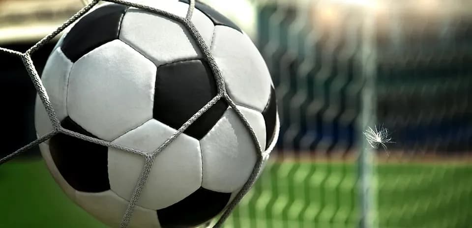 Soccer ball caught in goal netting