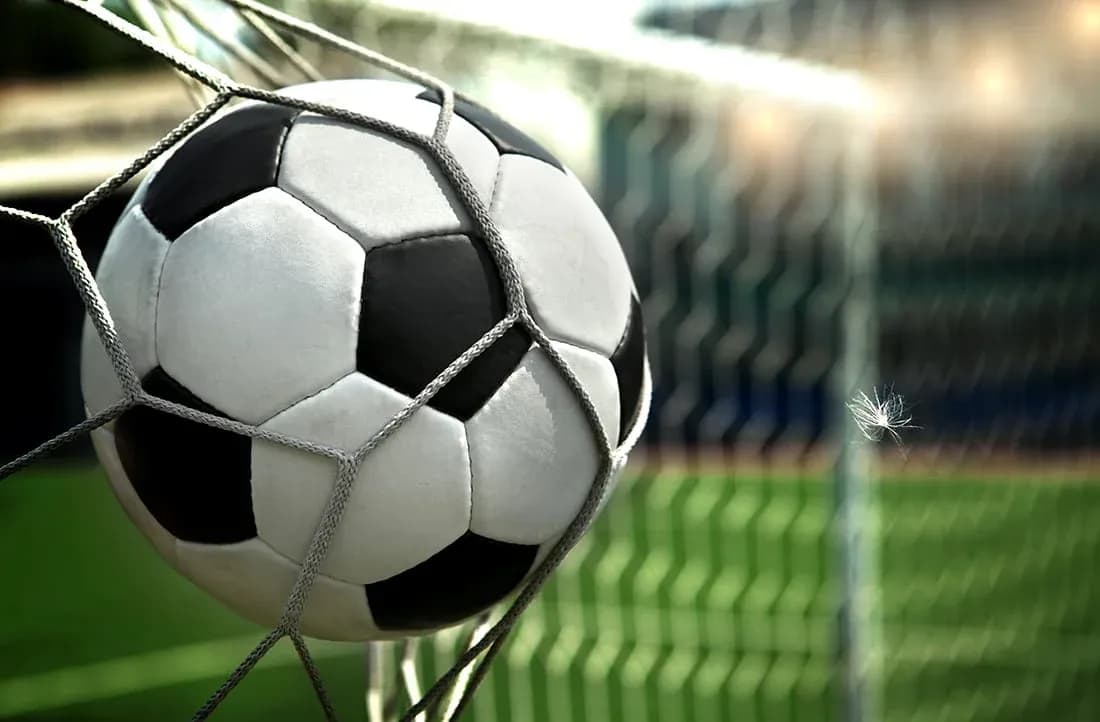 Soccer ball caught in goal netting