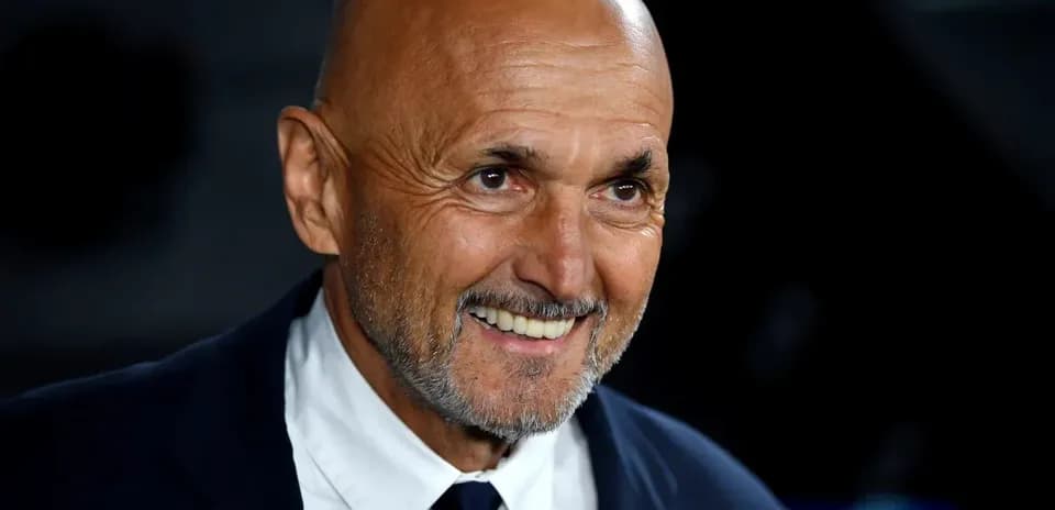 Smiling coach in a suit at event