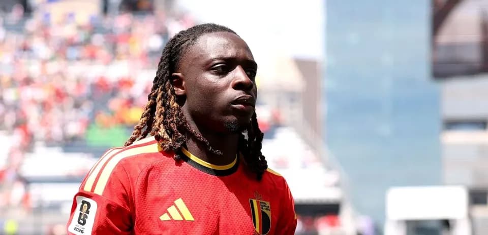 Belgian player in red jersey during match warm-up