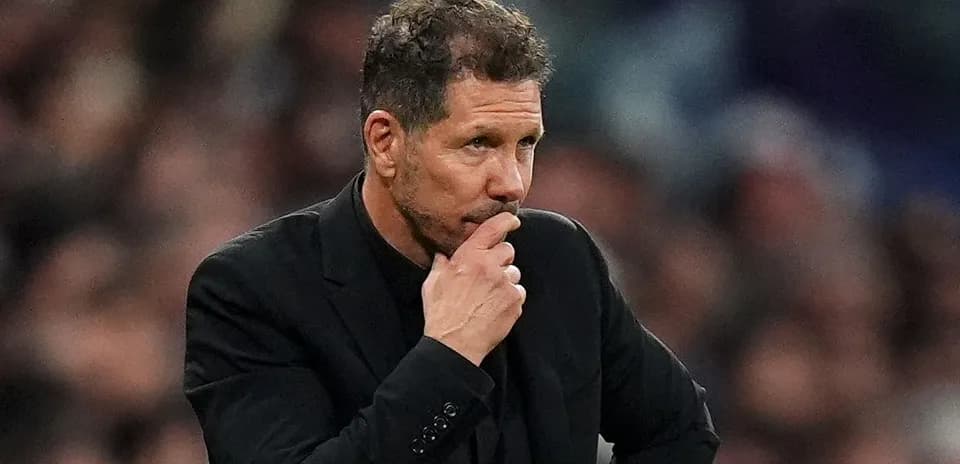 Coach pondering during a football match