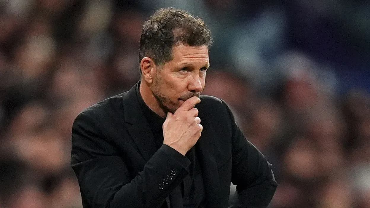 Coach pondering during a football match