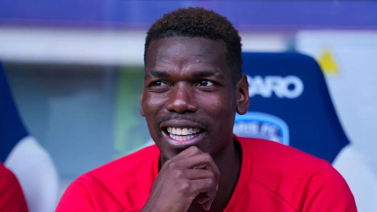 Player sitting on bench during match, smiling